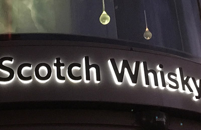 Push through Illuminated sign for a shop in Edinburgh